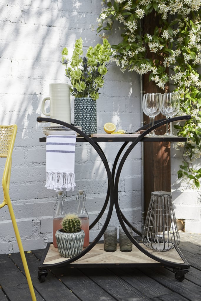 An adorable outdoor bar cart like this one makes it easy to entertain outdoors.  And when hosting guests al fresco, Jamie prefers to serve unfussy bites and libations. "Start with easy finger foods, seasonal fruits, and cocktails. The fewer plates, the better," she explains.