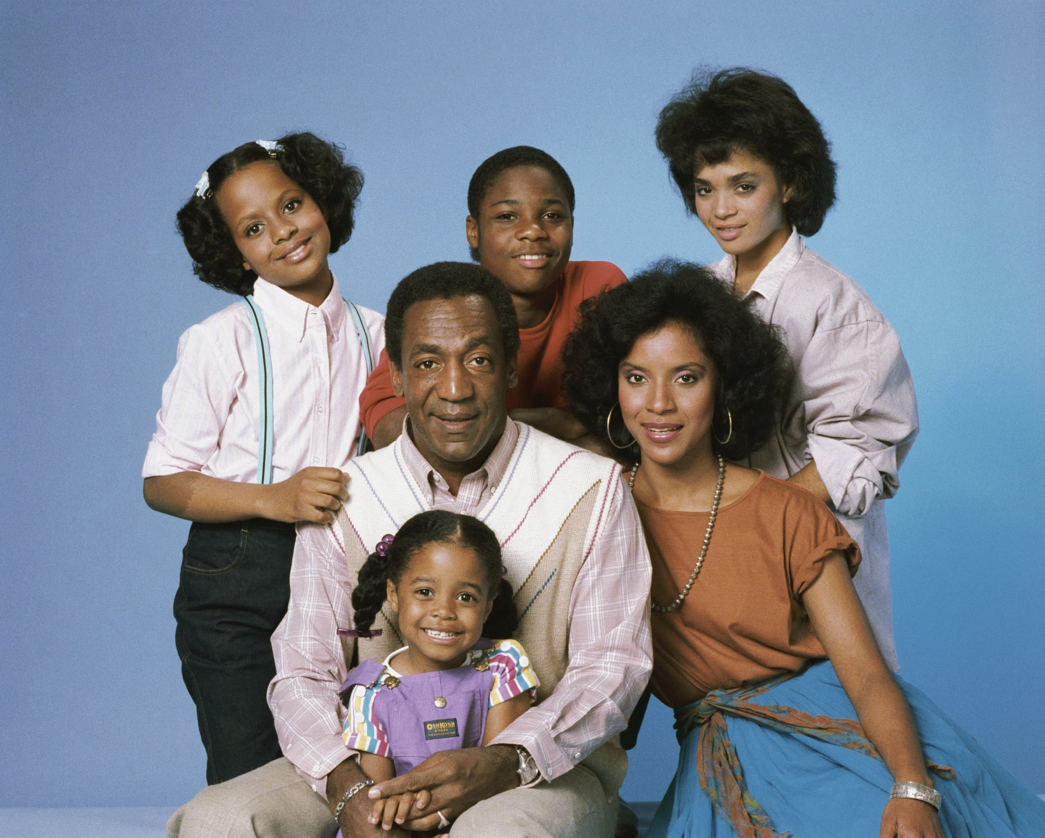 A photo to promote The Cosby Show. Pictured: (clockwise from top left) Tempestt Bledsoe as Vanessa Huxtable, Malcolm-Jamal Warner as Theodore 'Theo' Huxtable, Lisa Bonet as Denise Huxtable, Phylicia Rashad as Clair Hanks Huxtable, Keshia Knight Pulliam as Rudy Huxtable, (center) Bill Cosby as Dr. Heathcliff 'Cliff' Huxtable
