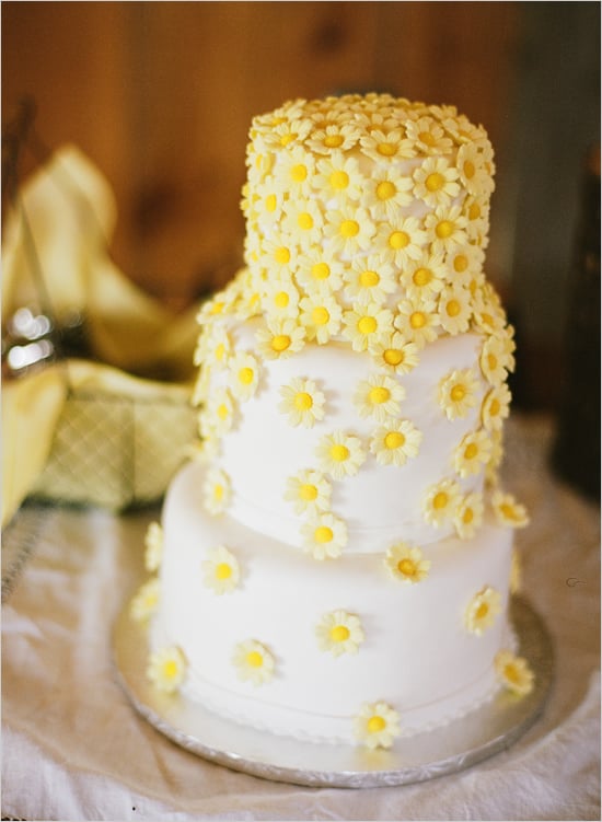 What better way to leave a lasting impression than with bright cascading daisies on a cake?
Photo by Austin Gros via Wedding Chicks