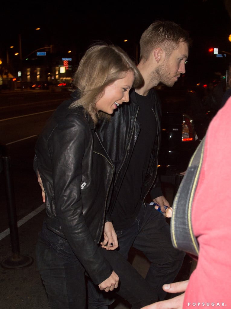 Taylor Swift was all smiles while holding Calvin Harris's hand on Thursday night. Just a week after Taylor and Calvin spent time together in Nashville, the pair was spotted showing some sweet PDA in LA. Both rocking all-black outfits, they went to Haim's concert in West Hollywood, where Taylor was spotted sitting in his lap. While Alana, Danielle, and Este Haim are among Taylor's circle of friends, Calvin worked with the sisters for the song "Pray to God." Keep reading to see pictures of Taylor and Calvin's night out, then see the surprising link between Taylor's boyfriends and BFFs.