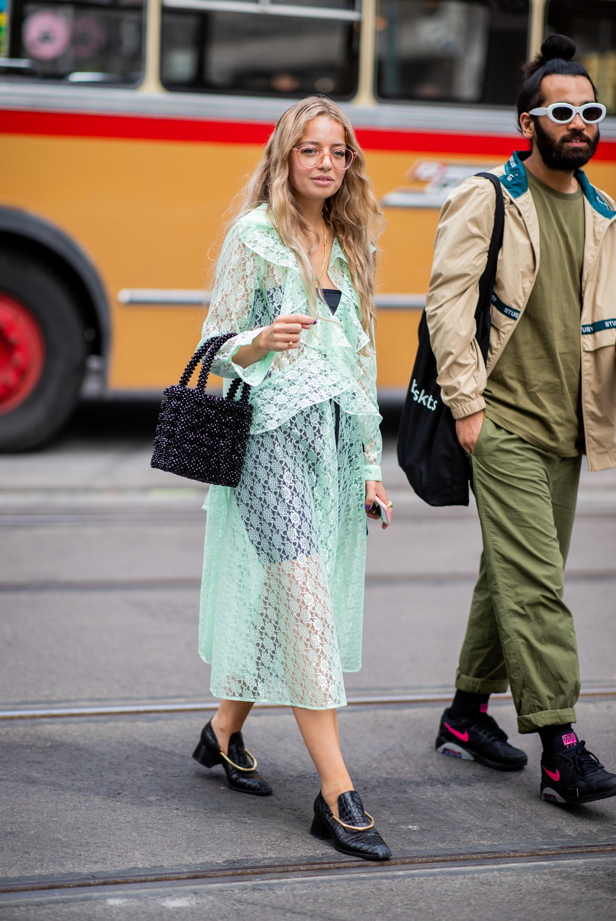 Styling a sheer mint-green dress with a bodysuit underneath., This Is by  Far the Riskiest Outfit We've Seen at Fashion Week