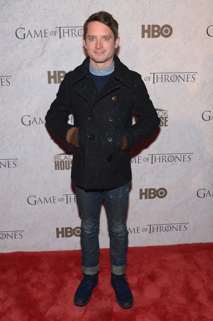 Elijah Wood stayed warm in his peacoat on Saturday.