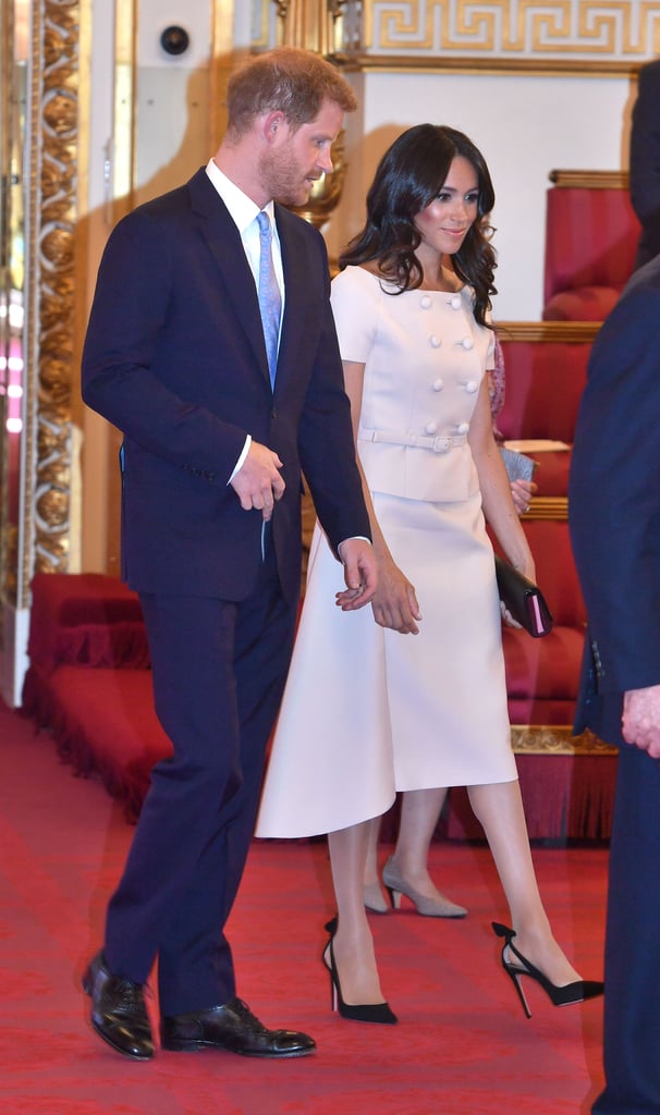 Meghan wore the black version of her Aquazzura slingbacks with a double-breasted pink Prada look for the queen's Young Leaders Awards Ceremony in June 2018.
