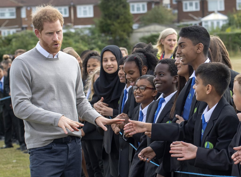 Prince Harry Hugs Kids at Lealands High School