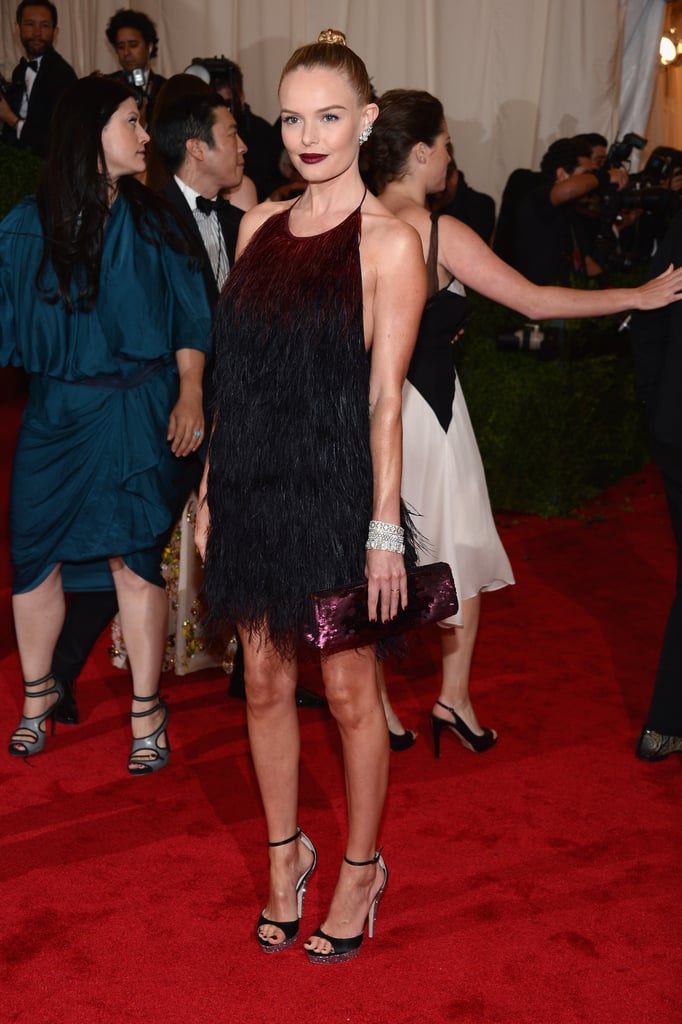 While most other stars were clad in floor-length gowns at the 2012 Met Gala, Kate proved that short and sweet could be just as glam. She shined in an ombré feathered Prada dress, which she paired with strappy sandals and a dark purple pout.