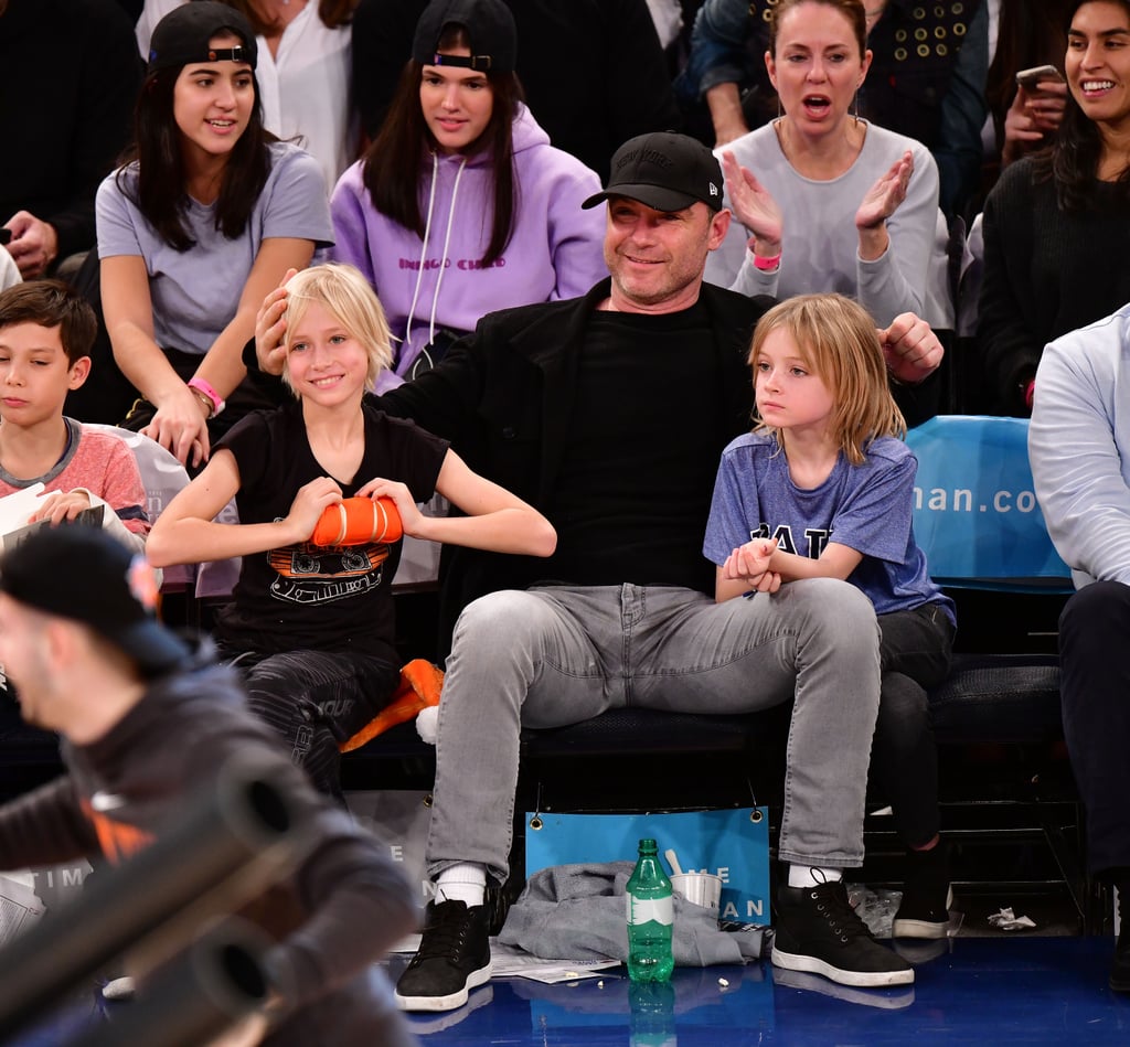 Liev Schreiber recently enjoyed some quality time with his best boys. On Sunday, the actor watched the Orlando Magic take on the New York Knicks at Madison Square Garden with his sons, Samuel and Alexander, whom he shares with ex Naomi Watts. Despite splitting last year, the two have remained friendly exes as they coparent their children. 
Aside from getting in some quality father-son time during the game, Liev made our hearts swoon as his youngest, Samuel, rested his head on his dad's lap. This isn't the first time the actor has gone into dad mode for the cameras. For the past two years, Liev has brought one of his sons as his date for the Emmys. Hopefully we'll see even more of them next award season. 

    Related:

            
            
                                    
                            

            It’s Time to Talk About the Scruffy Sexiness That Is Liev Schreiber