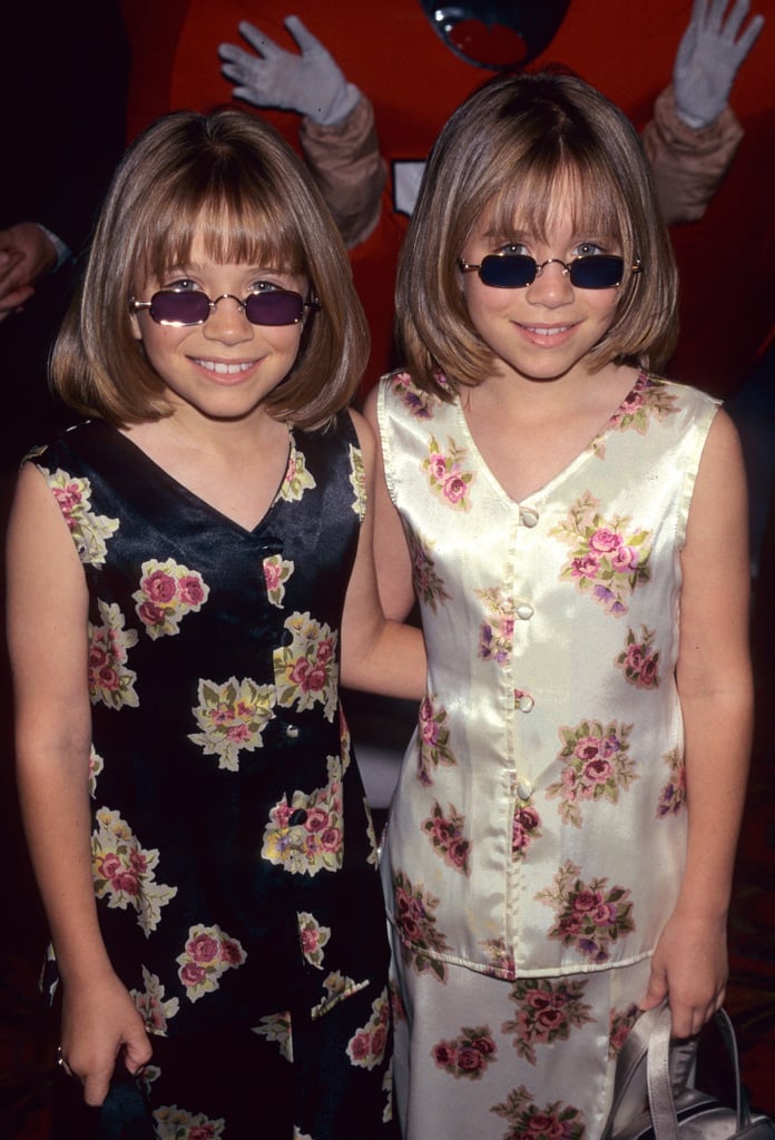 At the 1997 Audrey Hepburn Hollywood For Children Family Film Festival, the pair got groovy in silk floral outfits, chin-length cuts, and purple sunglasses.