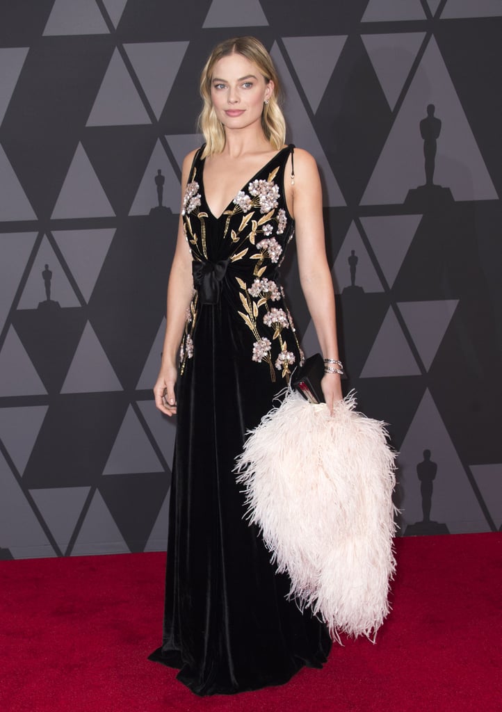 Margot's stunning look with feathered boa came courtesy of Prada and Altuzarra at the 2017 Governors Awards.
