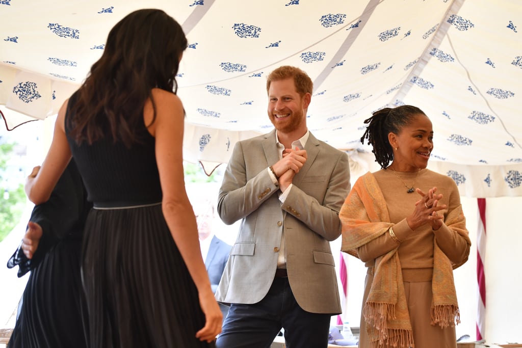 Prince Harry Fixing Meghan Markle's Hair at Cookbook Launch