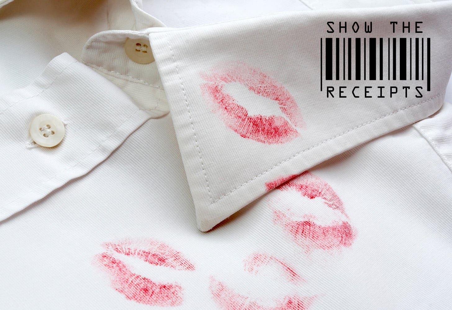 Red lip stick stain on a white collared shirt.