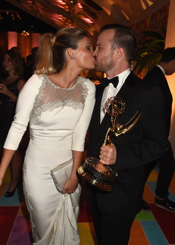 Aaron Paul kissed his wife, Lauren, after his big win.