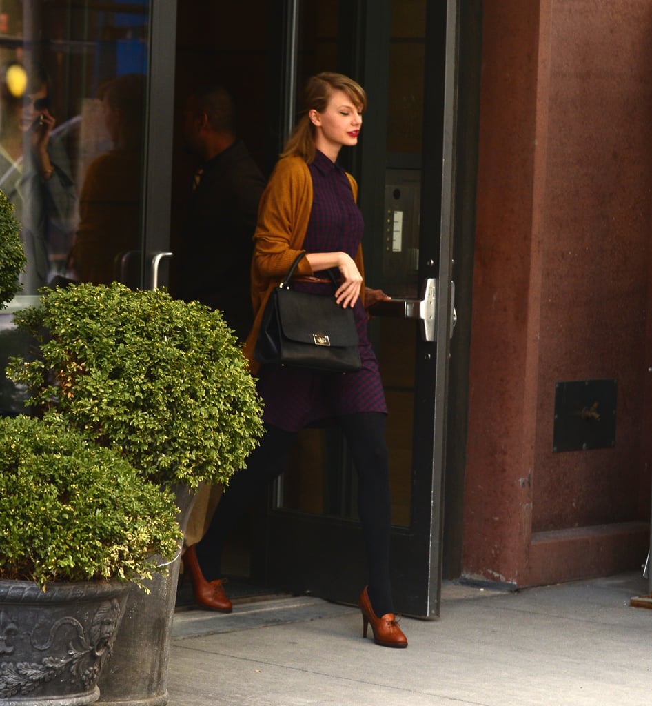 Looking fall-ready in this brown cardigan paired with a burgundy dress.