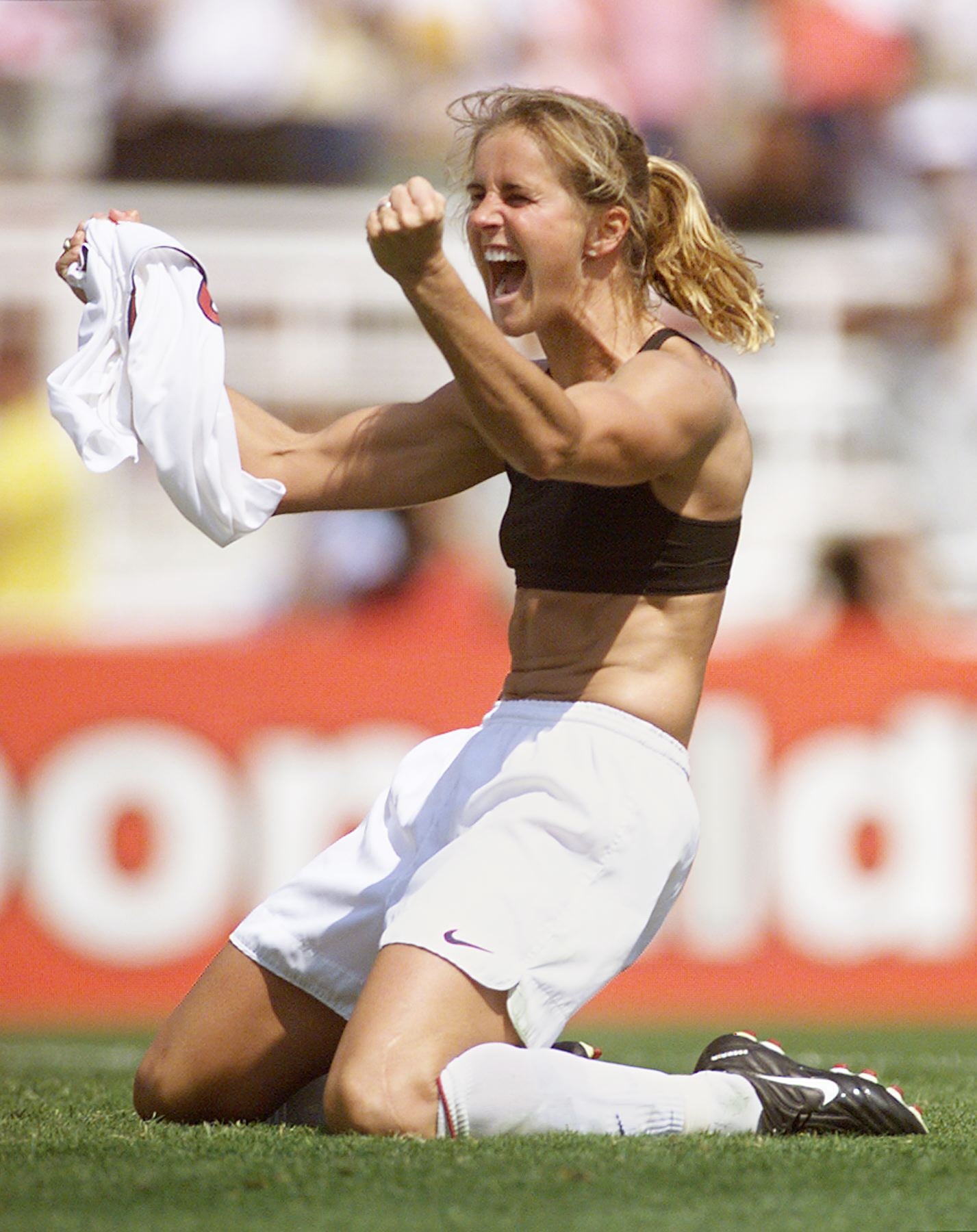 PASADENA, :  Brandi Chastain of the US celebrates after kicking the winning penalty kick to win the 1999 Women's World Cup final against China 10 July 1999 at the Rose Bowl in Pasadena. The US won 5-4 on penalties.  (ELECTRONIC IMAGE)   AFP PHOTO    Roberto SCHMIDT (Photo credit should read ROBERTO SCHMIDT/AFP via Getty Images)