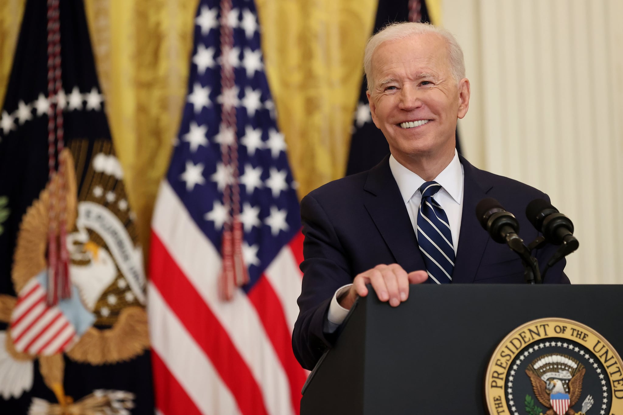 WASHINGTON, DC - MARCH 25: U.S. President Joe Biden smiles during the first news conference of his presidency in the East Room of the White House on March 25, 2021 in Washington, DC. On the 64th day of his administration, Biden, 78, faced questions about the coronavirus pandemic, immigration, gun control and other subjects. (Photo by Chip Somodevilla/Getty Images)