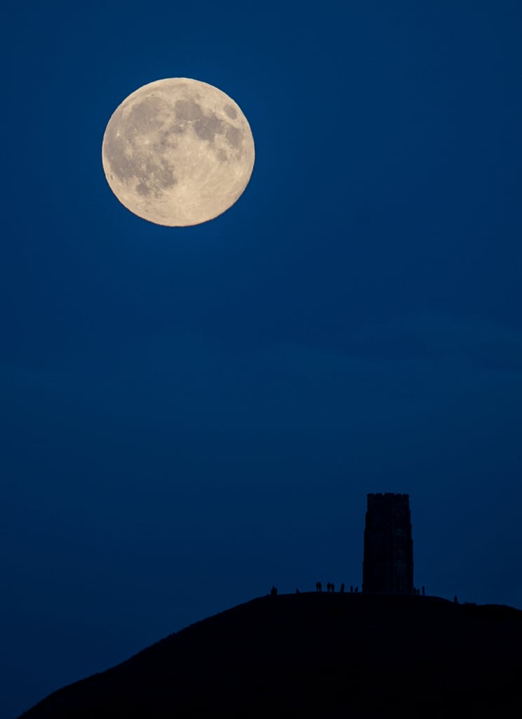Looks fake, doesn't it? Here, on Aug. 10, the supermoon rises above Glastonbury Tor in Somerset, England.