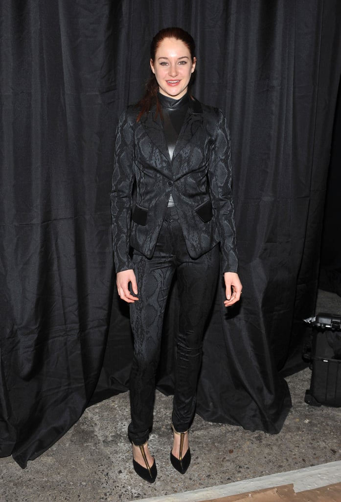Shailene Woodley suited up in a black python-print pairing at the Christian Siriano show. The starlet's black leather shell and t-strap pumps added extra texture to her wild combo.
Shailene Woodley suited up in a black python-print pairing at the Christian Siriano show. The starlet's black leather shell and t-strap pumps added extra texture to her wild combo.
