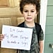 Boy Holding Lazy Version of First-Day-of-School Sign
