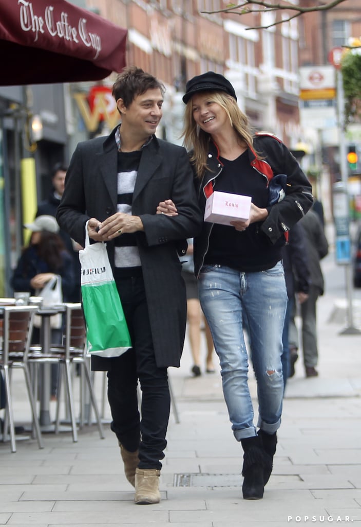The couple laughed together after stopping at a candy store in London in May 2013.