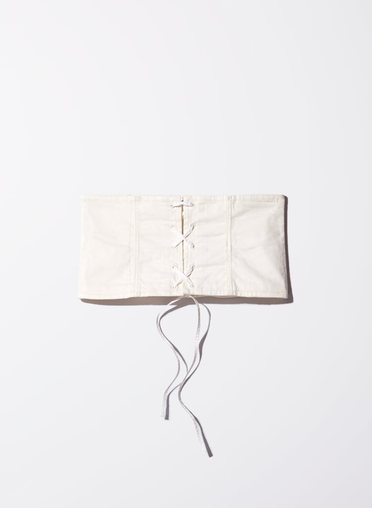 "I'm test-driving the corset trend with Aritzia's Audra corset ($50). Pro tip: pretend it's just another belt and start wearing it with everything — you won't be able to stop." — HWM