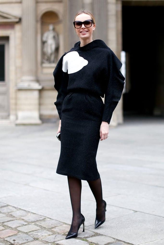 Architectural sleeves and a little more volume on top gave this sleek, ladylike look some edge.
Architectural sleeves and a little more volume on top gave this sleek, ladylike look some edge.