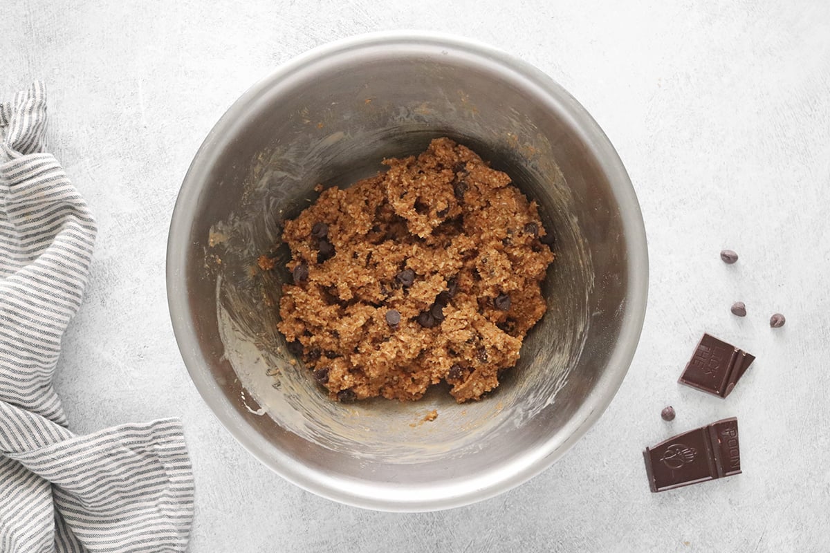 Adding chocolate chips to dough