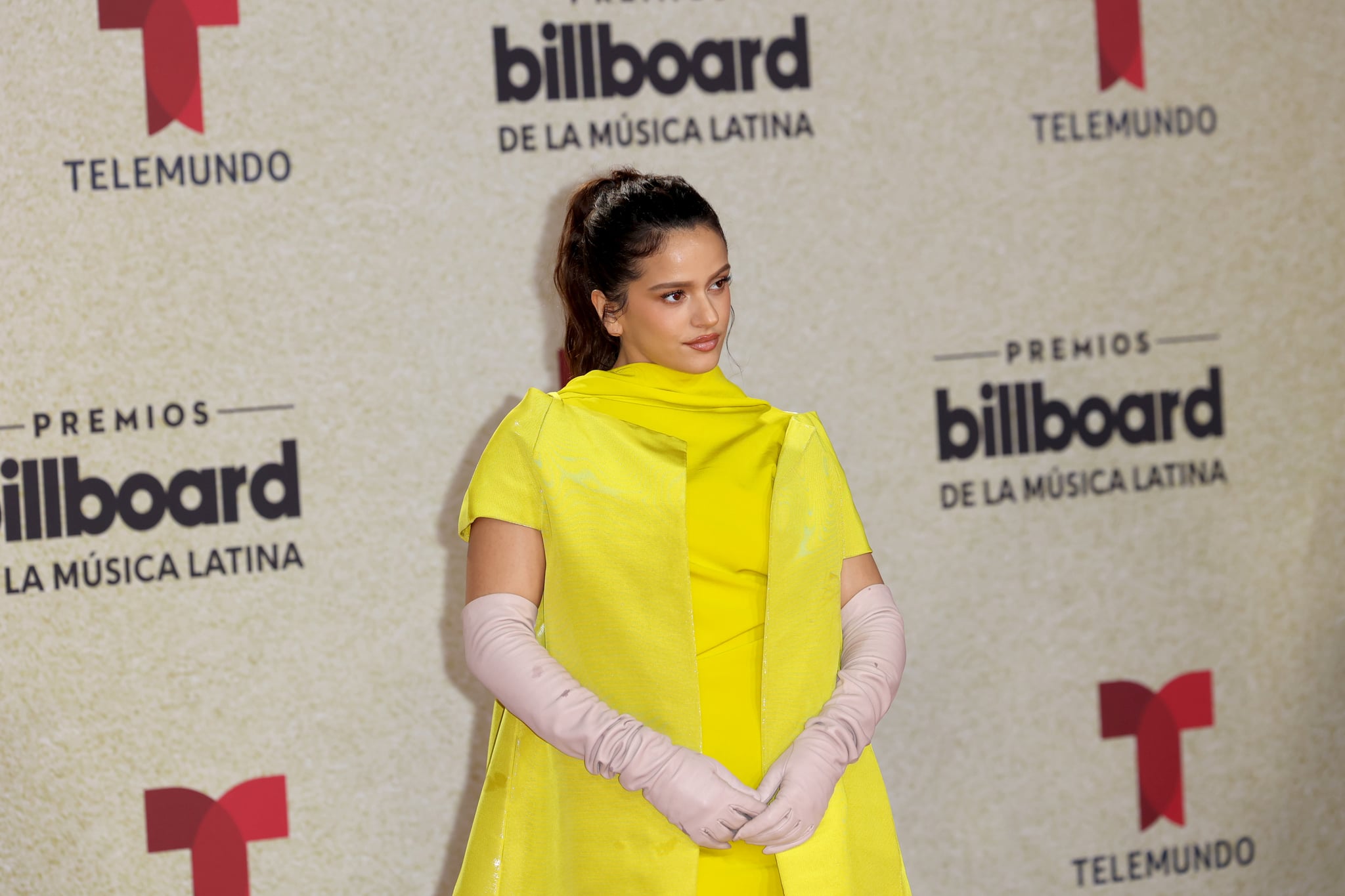 Rosalia seen wearing a yellow R. Simons oversized pullover dress