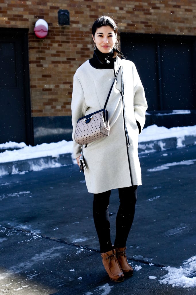 A creamy coat is a sharp style for dark days, and a crossbody is all the better for leaving hands free to deal with umbrellas.
