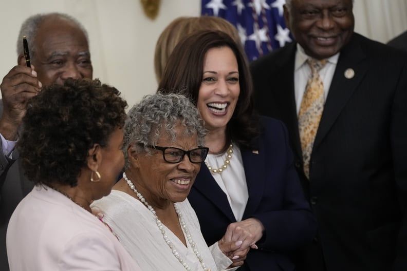 WASHINGTON, DC - JUNE 17: (L-R) 94-year-old activist and retired educator Opal Lee, known as the Grandmother of Juneteenth, holds hands with Vice President Kamala Harris as U.S. President Joe Biden signs the Juneteenth National Independence Day Act into l