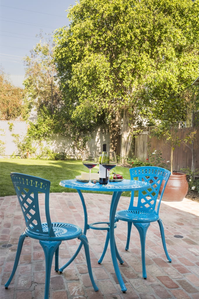 The front yard was outfitted with a set of bistro chairs and a table from Pier 1.