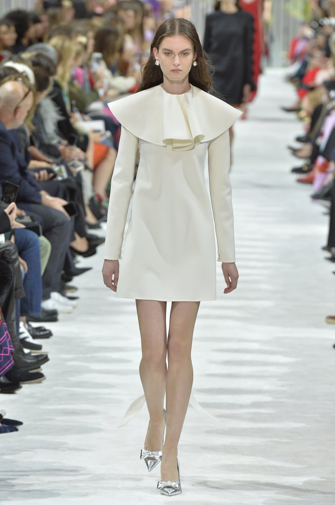 We can imagine Melania shopping the Valentino Spring 2018 collection for something lightweight, but statement-making. The ruffled collar on this ivory shift would help her stand out. We can imagine Melania shopping the Valentino Spring 2018 collection for something lightweight, but statement-making. The ruffled collar on this ivory shift would help her stand out.