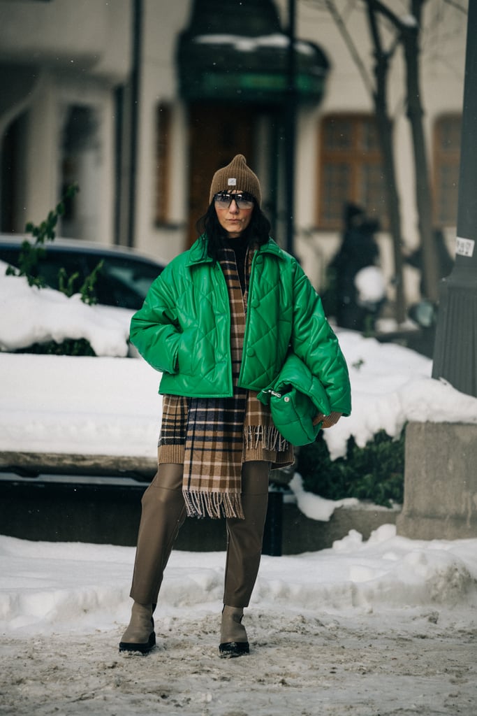 Get creative with your proportions — a cropped electric green bomber looks so cool over a longer-length plaid scarf.