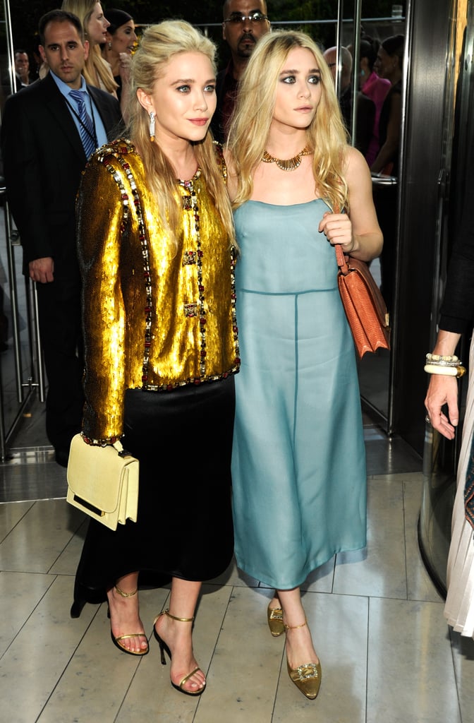 Twinning combo: For the 2011 CFDA Fashion Awards, both girls kicked it into high gear with high-shine pieces.

Mary-Kate donned an embellished gold Chanel topper, black high-low skirt, and pastel bag by The Row.

Ashley went a little more subtle in a sheen, baby-blue creation and burnt-orange crocodile bag, both by The Row, with metallic ankle-strap pumps.
