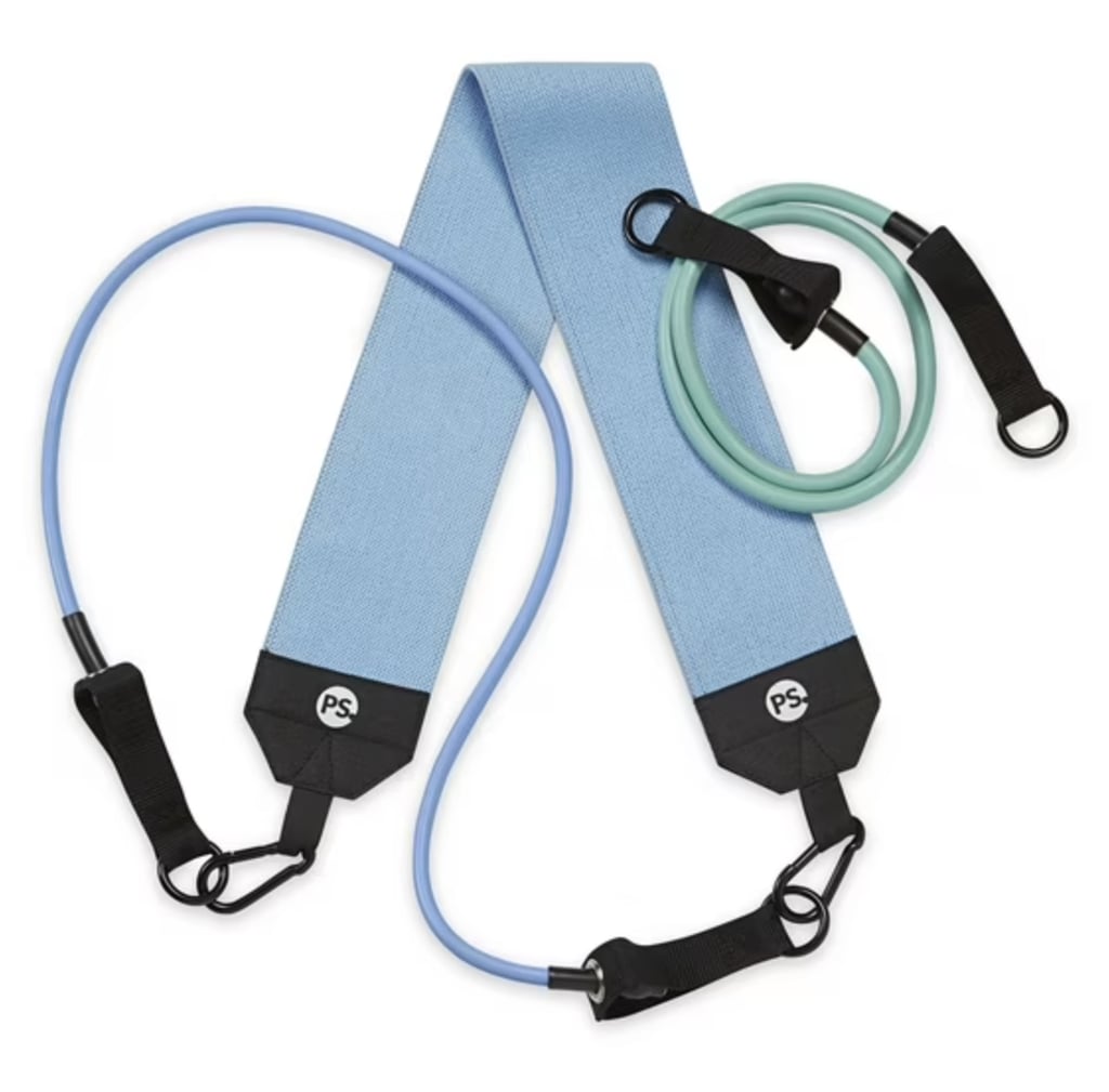 Popsugar Hip Trainer Resistance Tube ($17, originally $20)
The Popsugar Hip Trainer makes lower-body workouts way easier — and way more effective. It comes with two resistance cords (light and medium) plus a comfy fabric squat band so you can sculpt your thighs, hips, and booty hands-free. Use it for glute kickbacks, squats, or whatever your routine calls for, and flip through the included guide for fresh workout ideas.