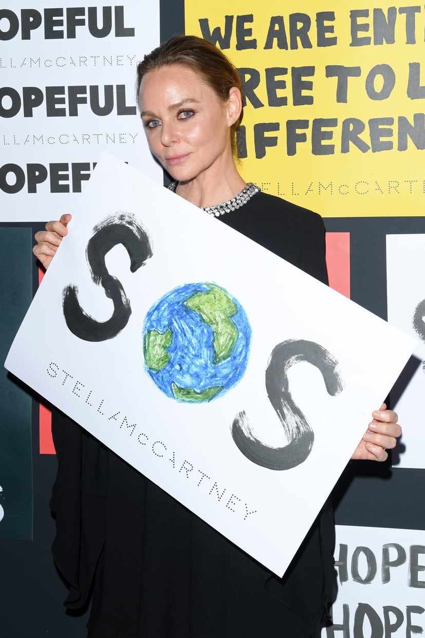 MILAN, ITALY - JUNE 14: Stella McCartney poses with a sign readin 'SOS' during the presentation of Stella McCartney during the Milan Men's Fashion Week Spring/Summer 2020 on June 14, 2019 in Milan, Italy. (Photo by Daniele Venturelli/Getty Images)