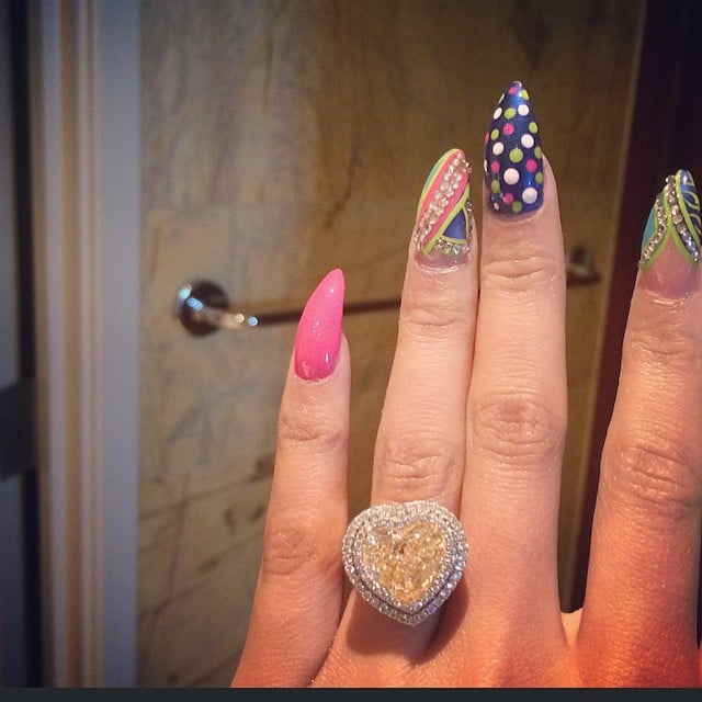 While Nicki's manicure is superfun, we can't stop staring at her maybe-engagement ring. She also posted a suspicious, emoji-filled tweet, hinting at the news.