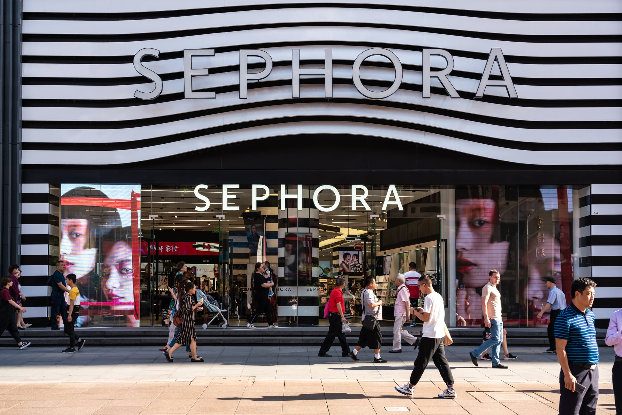 SHANGHAI, CHINA - 2019/09/20: Pedestrians walk past a Sephora outlet on East Nanjing Road in Shanghai. A French multinational chain of personal care and beauty stores. (Photo by Alex Tai/SOPA Images/LightRocket via Getty Images)