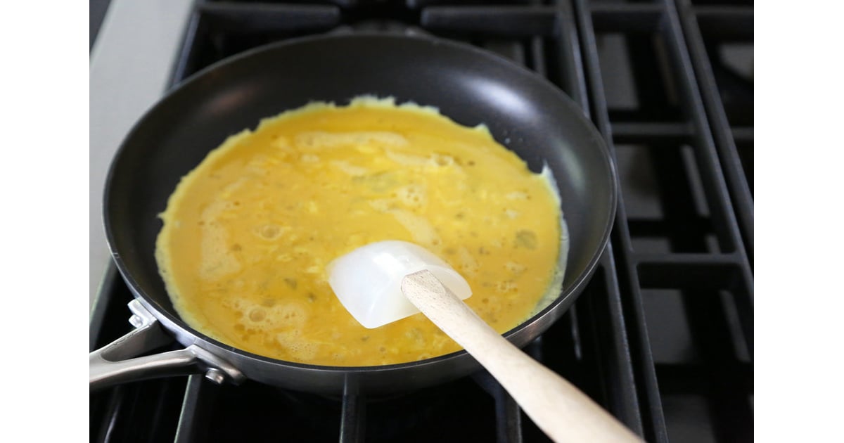 Whisk with one hand and shake the pan vigorously with the other