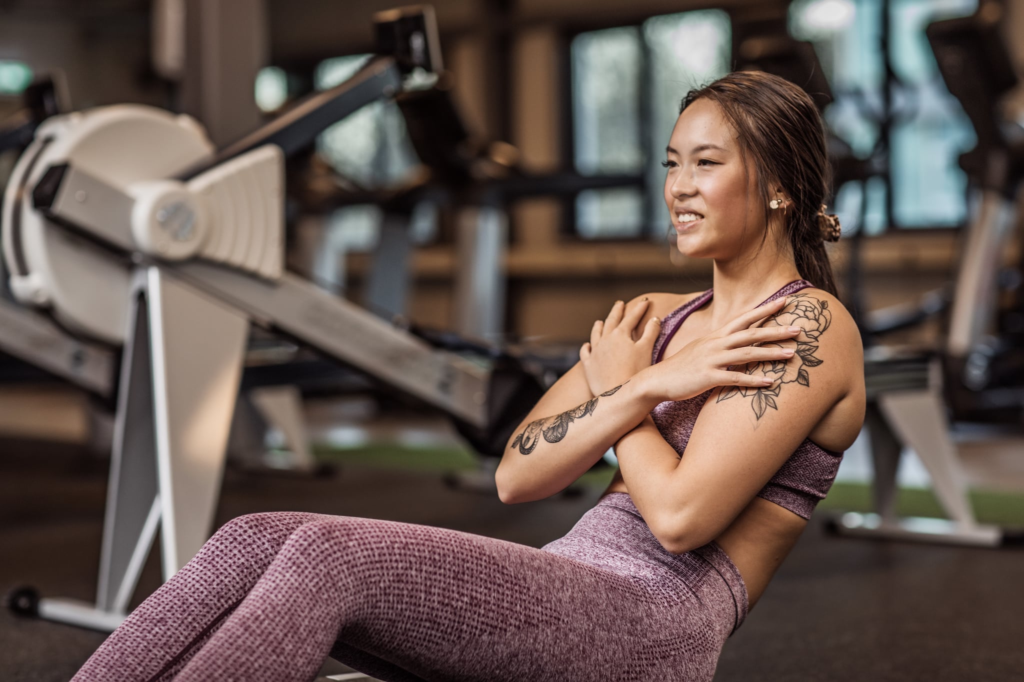 Beautiful asian female working out in the Gym