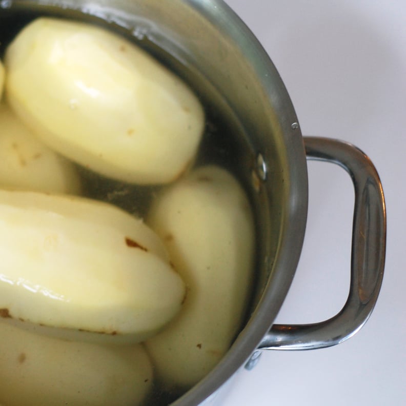Adding your potatoes to boiling water.