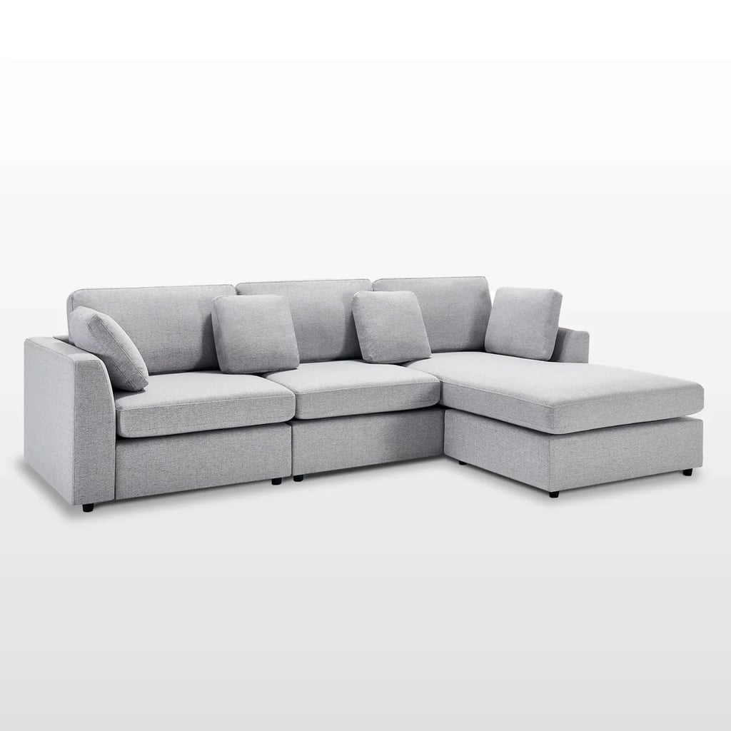 Wade Logan Wauseon 108.7" W Upholstered Sofa with Convertible Chaise ($1,020, originally $1,175)
I can't help but feel like this sofa fits the "first adult couch" vibe perfectly. It is a bit bigger than your average apartment or dorm room sectional and offers more in both functionality and size. Seating up to three people, this design invites guests to relax and welcomes them into a spacious seating arrangement. Bonus points for the modern design! What we love:

The convertible chaise makes this adaptable to various seating options.

Who it's best for:

The tailored features make the upholstered design feel sleek, modern, and elevated. 
The fabric is known to be ultra-soft yet durable for busy households.

Who should avoid it:

The six color options all fall into a neutral palette, making this more of subtle focal point rather than a bold statement in a room. 

The Details: Width: 108.7" | Height: 33.9" | Depth: 64.2" | Upholstery: Polyester Blend and Chenille | Color Options: 6
