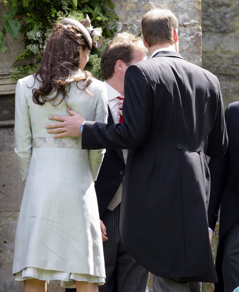 William rested his hand on Kate Middleton's back at a wedding in June.
William rested his hand on Kate Middleton's back at a wedding in June.