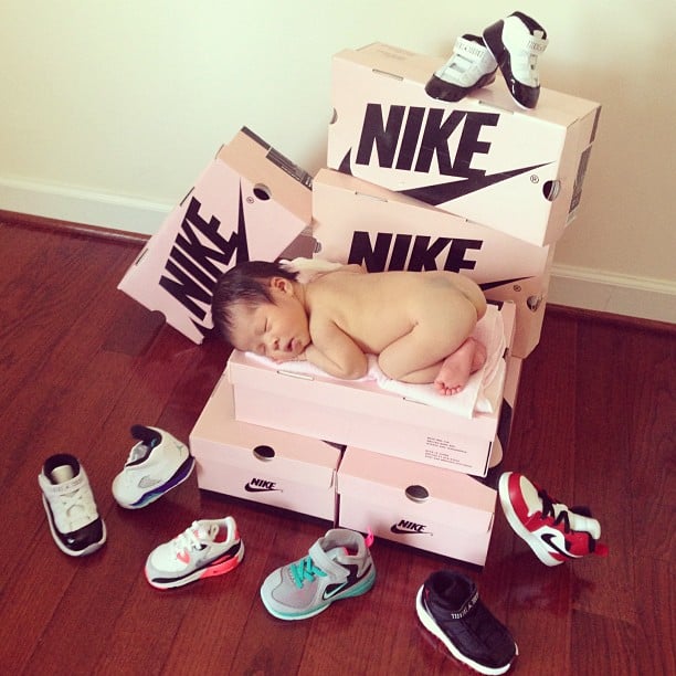 On a Stack of Nike Shoe Boxes