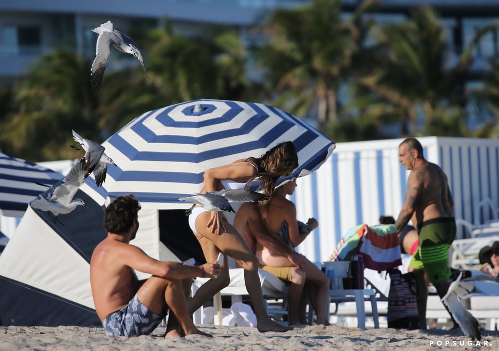 Alessandra Ambrosio Chased by Birds on the Beach in Miami