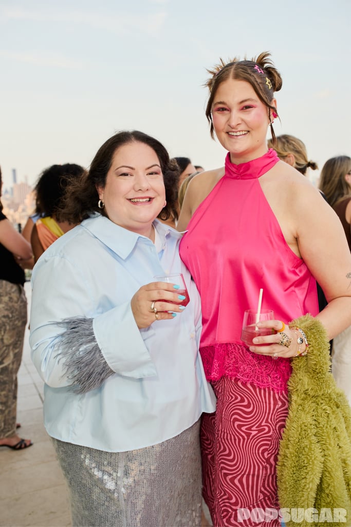 Emily Zirimis and Summer Bockart cheers outside.