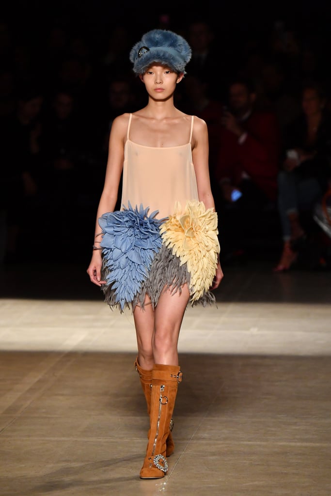 Natalia as a face of Miu Miu, Miuccia Prada's more playful line, makes total sense. We think she could rock this dainty-strapped Fall 2017 mini with a sprawling of feathers at the hem.