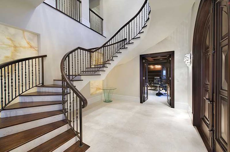 There Is A Grand Entryway With A Sweeping Staircase