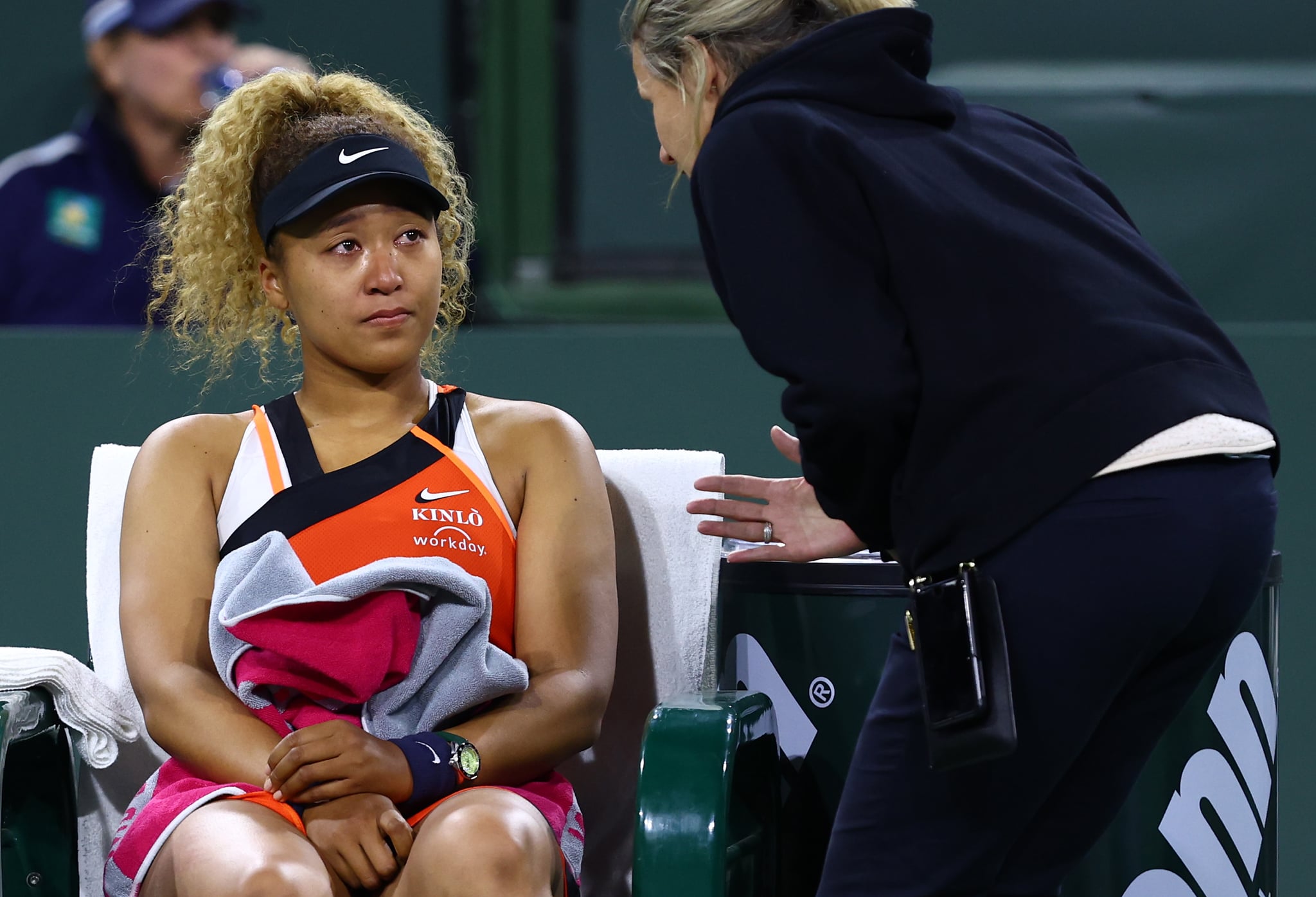 INDIAN WELLS, CALIFORNIA - MARCH 12: Naomi Osaka of Japan speaks with WTA supervisor Clare Wood after play was disrupted by a shout from the crowd during her straight sets defeat against Veronika Kudermetova of Russia in their second round match on Day 6 of the BNP Paribas Open at the Indian Wells Tennis Garden on March 12, 2022 in Indian Wells, California. (Photo by Clive Brunskill/Getty Images)