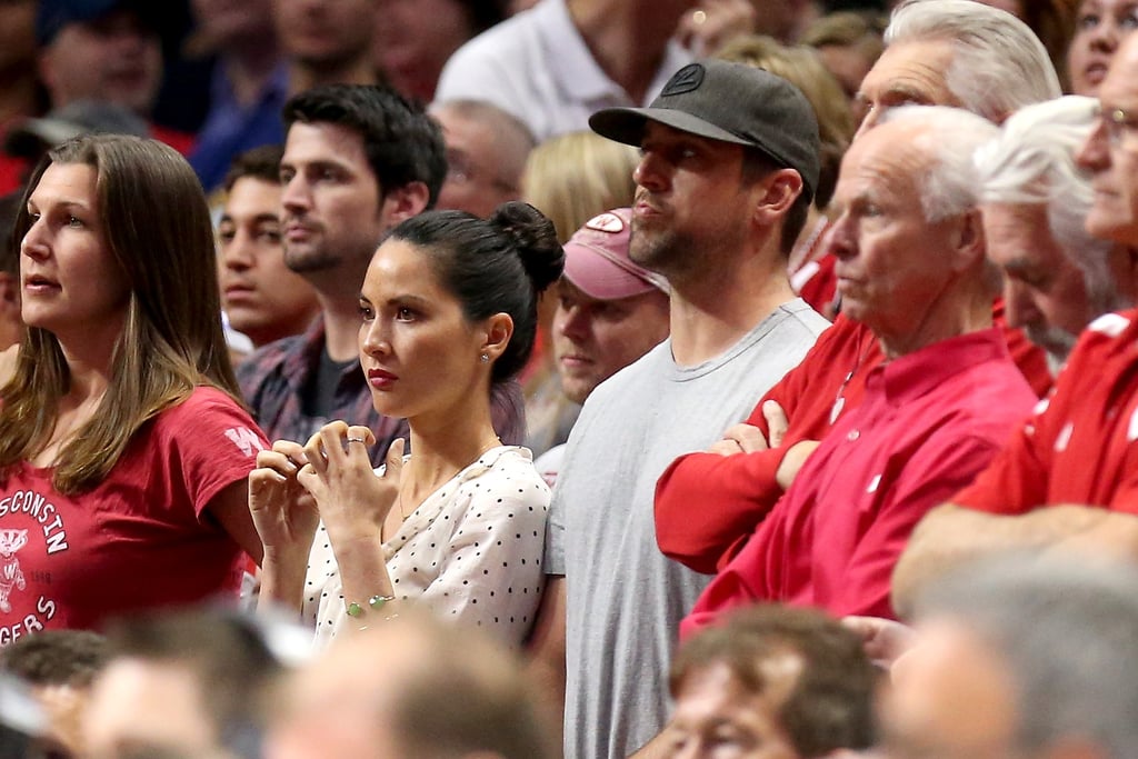 Olivia Munn and Aaron Rodgers were engrossed in a Thursday night basketball game in LA.