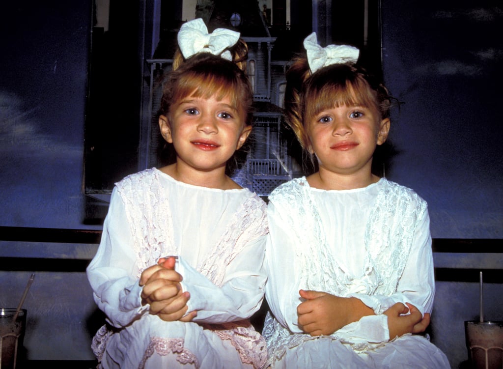 Back in 1993, Mary-Kate and Ashley were living up their fame as Michelle Tanner on Full House. The pair was spotted at Planet Hollywood in coordinated pink and white outfits with blunt bangs, high ponytails, and big bows.