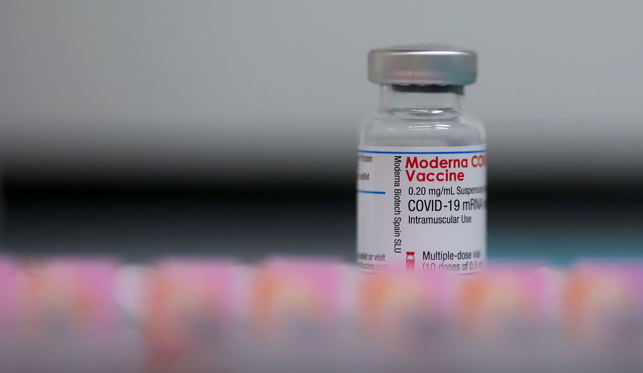 A vial with the Moderna Covid-19 vaccine is displayed at the corona vaccination centre at the University hospital in Magdeburg, eastern Germany, on January 22, 2021. (Photo by Ronny Hartmann / AFP) (Photo by RONNY HARTMANN/AFP via Getty Images)